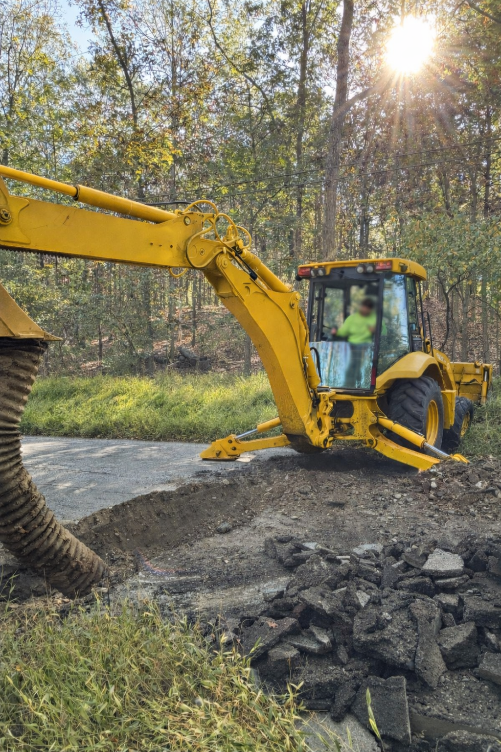Removing an old roadside drain and installing a new culvert pipe for improved drainage in Warren County NJ
